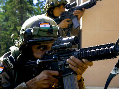 Indian soldiers from the 6th Battalion, Kumaon Regiment provide security while conducting company movement procedures alongside the 1st Brigade, 2nd Infantry Division during Exercise Yudh Abhyas 2015’s culminating training event at Joint Base Lewis–McChord, Washington, US