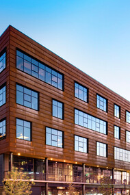 The striking metal panels on this modern building not only enhance its aesthetic appeal but also offer durability and sustainability, making it a top choice for innovative architecture