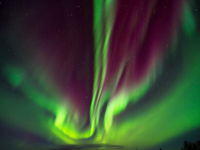 Purple and green bands of light above the Koyukuk National Wildlife Refuge in Alaska, 2013