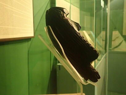 A side profile of the Idol showing stacked faces — Some researchers interpret these as a spiritual hierarchy or ancestral lineage, Russia