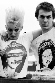 Pamela Rooke, known as Jordan, and Simon Barker, called Six, model Westwood's 'God Save The Queen' tees