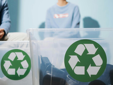 Waste being sorted into boxes as part of smart waste management