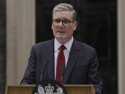 Sir Keir Starmer, accompanied by his wife Victoria, arrives at Number 10 Downing Street in London to give a speech after being appointed Prime Minister