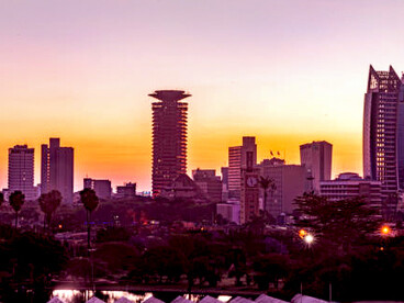 The Johannesburg skyline bathed in the warm hues of the evening sun, highlighting the city’s business district, South Africa