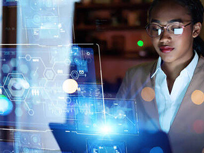 A young woman in the office at night, using systems engineering to harness generative AI for digital transformation