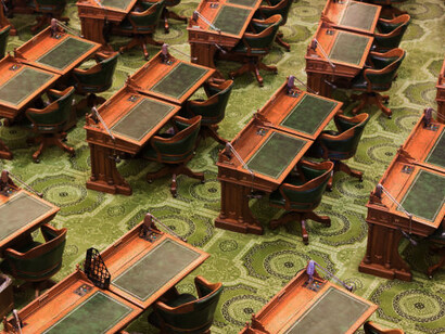 Empty California State Assembly chamber with rows of chairs, USA
