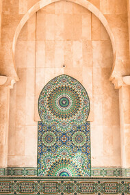 The stunning Moroccan tiles and intricate artistry of the mosque in Casablanca, Morocco, reflect the deep reverence Moroccans have for their sacred places during Ramadan, where spirituality and culture intertwine