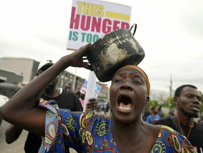 A woman protest against hardship on the street of Lagos, Nigeria, Thursday, Aug. 1, 2024. Thousands of mostly young people poured onto the streets across Nigeria on Thursday as they protested against the country's worst cost-of-living crisis in a generation. Security forces fired tear gas to disperse some of the protesters in the capital, Abuja by Sunday Alamba/AP