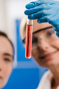 Expert doctors are depicted analyzing substances in the lab