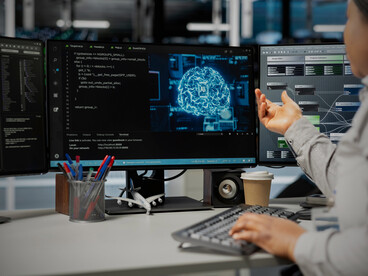 Engineers refine an AI architecture, reflecting the worldwide sprint to build smarter, faster, sovereign systems