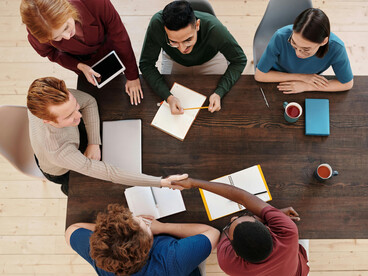 Individuals meeting to align their perspectives