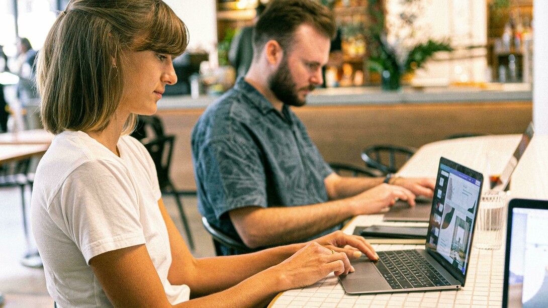 Coworkers using AI tools working smarter and reaching more customers to build a strong brand