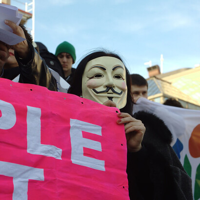 A man wearing a Guy Fawkes mask protests against the ACTA treaty at Republic Square in Belgrade, Serbia