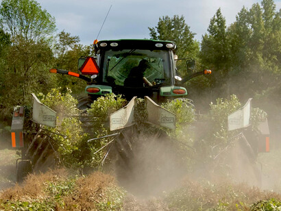 Tractor plowing a field, representing sustainable agriculture, climate-friendly farming, and modern smart farming technology