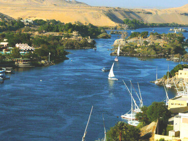 The Nile River, one of the longest rivers in the world, flows northward across Africa into the Mediterranean Sea. Stretching about 6,650 kilometers (4,130 miles), its vast drainage basin spans eleven countries: the Democratic Republic of the Congo, Tanzania, Burundi, Rwanda, Uganda, Kenya, Ethiopia, Eritrea, South Sudan, Sudan, and Egypt