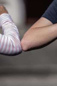 People no longer greet each other by shaking hands and kissing