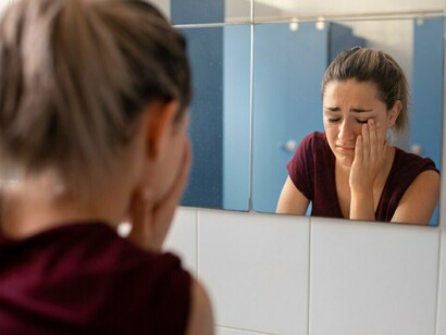 A student enduring bullying at school, grappling with loneliness and isolation, but discovering her inner strength