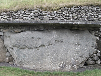 The carved stone on the rear outer wall of the Newgrange Tomb in Ireland