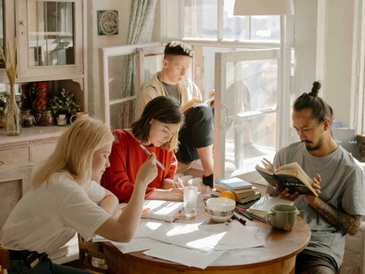A bunch of students studying, showing real human effort behind academic success