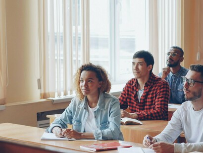 Students paying attention in the classroom, showing how education help students become more informed and responsible digital citizens in an increasingly interconnected world