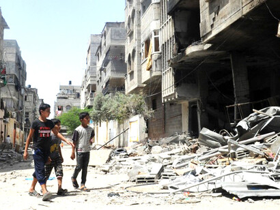 In the northern Gaza Strip, Palestinians sift through the ruins of homes leveled by Israeli strikes