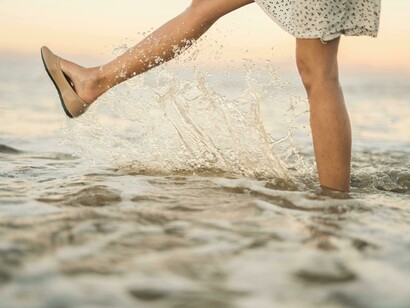 Women stepping into water and its ripple effect, every ripple tells a story 