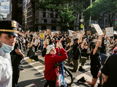 In the heart of New York, a movement of activists raises their voices and arms, demanding justice and human rights