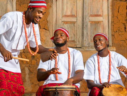 Nigerian men using traditional instruments, showcasing how communal bonds are rooted in history rather than doctrine