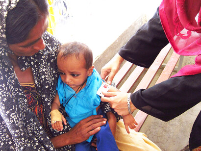 A young girl undergoes a malnutrition screening in Sindh, Pakistan, April 2012