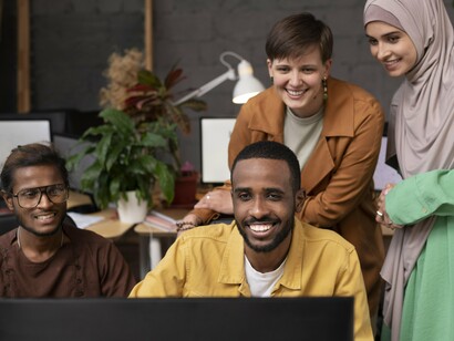 A diverse team collaborating on a project, symbolizing the spirit of partnership at the heart of Fulbright programs between Morocco and the United States