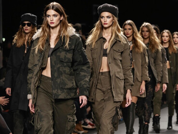 Models walking on the catwalk in camouflage outfits