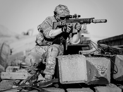 Soldiers training for combat, representing the rigorous training to prepare for the challenges ahead and their commitment to serving their country 