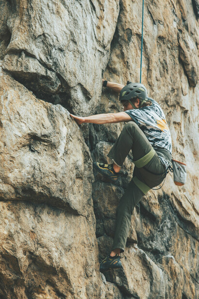Gastonia, North Carolina, USA, a climber in a helmet ascends a rock wall, representing risk-taking and personal growth