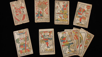 Twelve cards from a tarot deck with French text