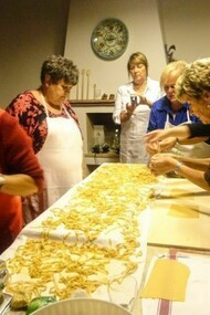 A group of nonnas cooking pasta