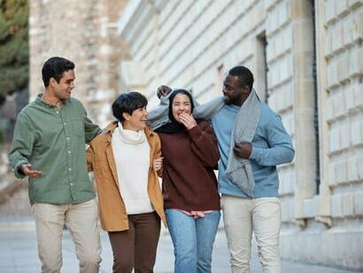 Cross-cultural conversations and bonding, illustrating the shared experiences of expats and immigrants navigating language barriers and cultural differences