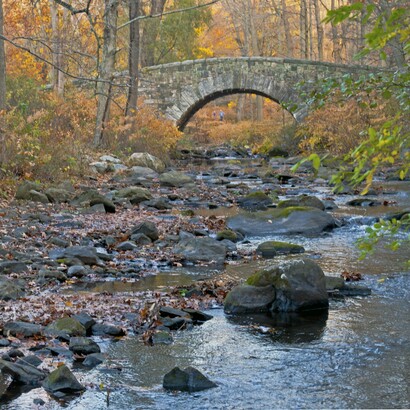 Stone arch bridge over the Pocantico River in Rockefeller State Park Preserve, Sleepy Hollow, NY, USA