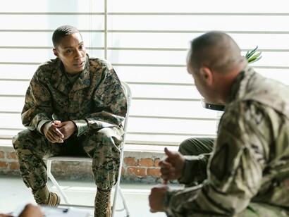 A distressed soldier expressing his thoughts during a therapy session, reflecting the emotional toll and psychological aftermath of war