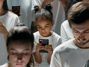 Young couple addicted to their phone screens