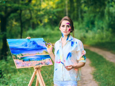 A lone artist in the woods, symbolising the reclaiming of space for her own transformation