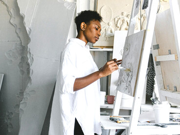 Amid the creative chaos of her studio, a woman artist finds peace in her personal sanctuary