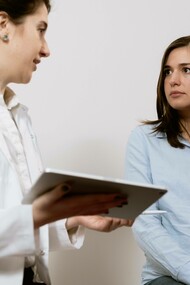 A doctor consulting their patient regarding their PCOS diagnosis
