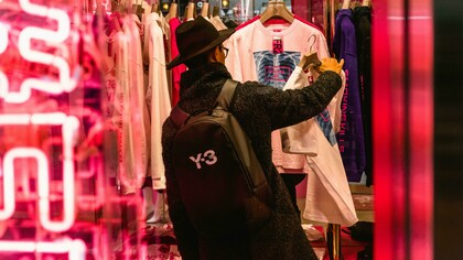 Man browsing for clothes and secondhand apparel