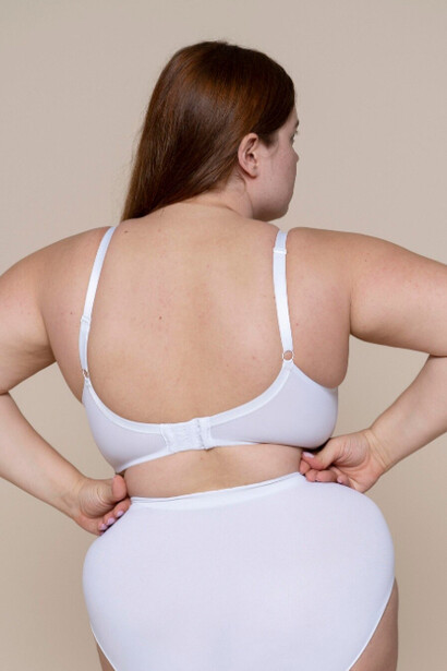 A plus size model shows confidence in every curve that defines her body 