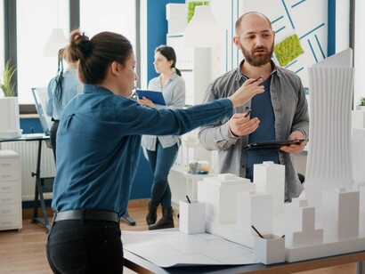 Architects and engineers collaborate on structural models to refine project design