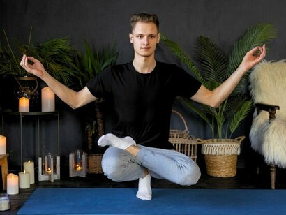 A man seated in mindful meditation, symbolising clarity emerging from mental stillness