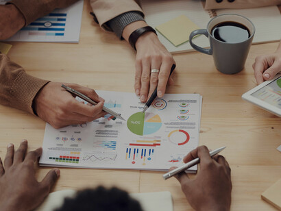 People analyzing graphs and rates while discussing investment products, financial instruments, derivatives, and tailored investment strategies