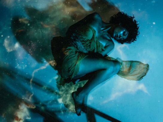 Woman in a dress lying beneath the water’s surface