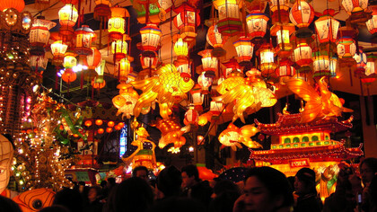 As dusk falls over Nagasaki, Japan, the vibrant red and yellow glow of thousands of lanterns transforms the streets into a breathtaking spectacle, inviting all to experience the magic of the Lantern Festival in the city