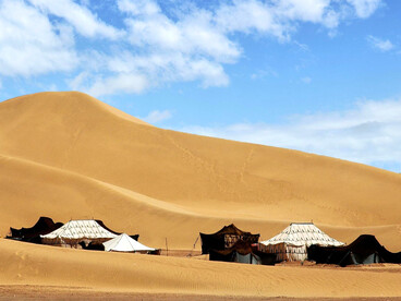 A group of traditional Berber tent in M'hamid El Ghizlane, highlighting the understated elegance of nomadic design